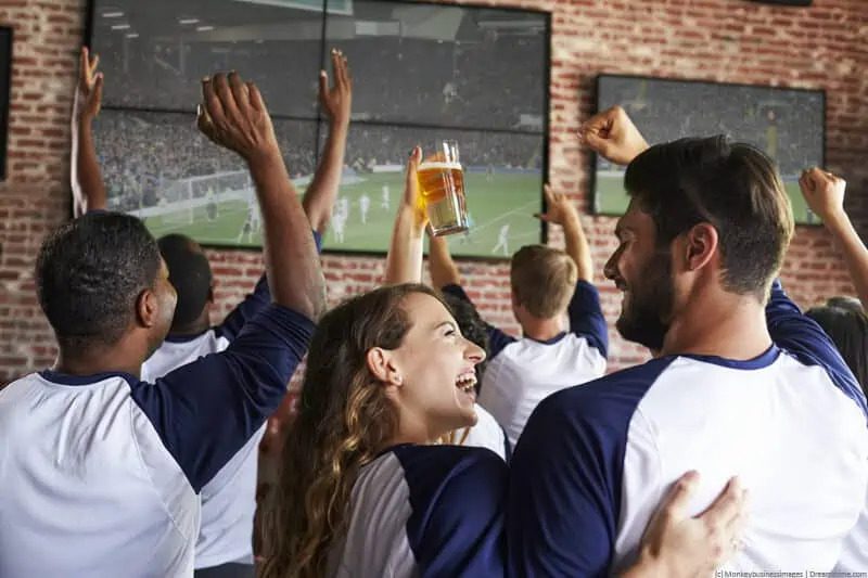 people watching sport together on sports club digital signage